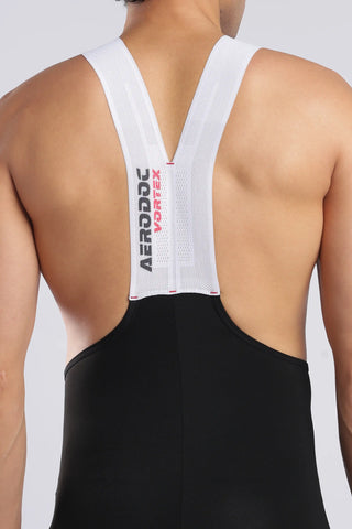 Back view of a person wearing a black athletic garment with a white V-neck harness-style strap and visible Aerobic Portes branding on the center strap.