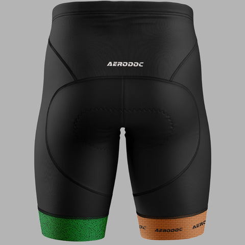 Black Aerodoc cycling shorts with a green textured band at the lower left leg and an orange textured band at the lower right leg, shown from the back on a solid gray background.