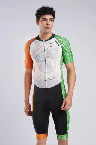 A male model wearing a AERODOC trisuit. The trisuit features a white center with a faint map graphic, orange sleeves, and green patterned sides, with the Indian flag colors (saffron, white, and green) running vertically.