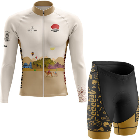 Cycling jersey and shorts with desert-themed design on a white background