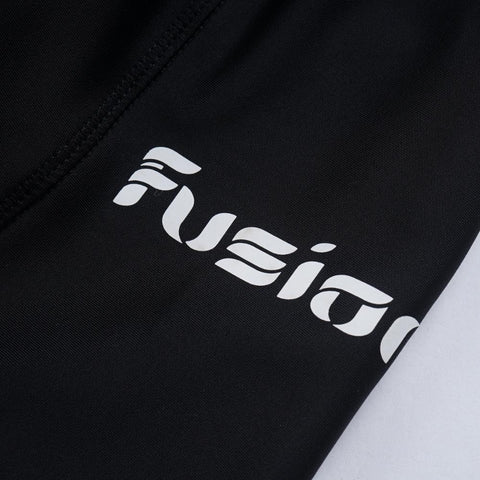 Close-up of Fusion branding on black Gel Padded Cycling Shorts.