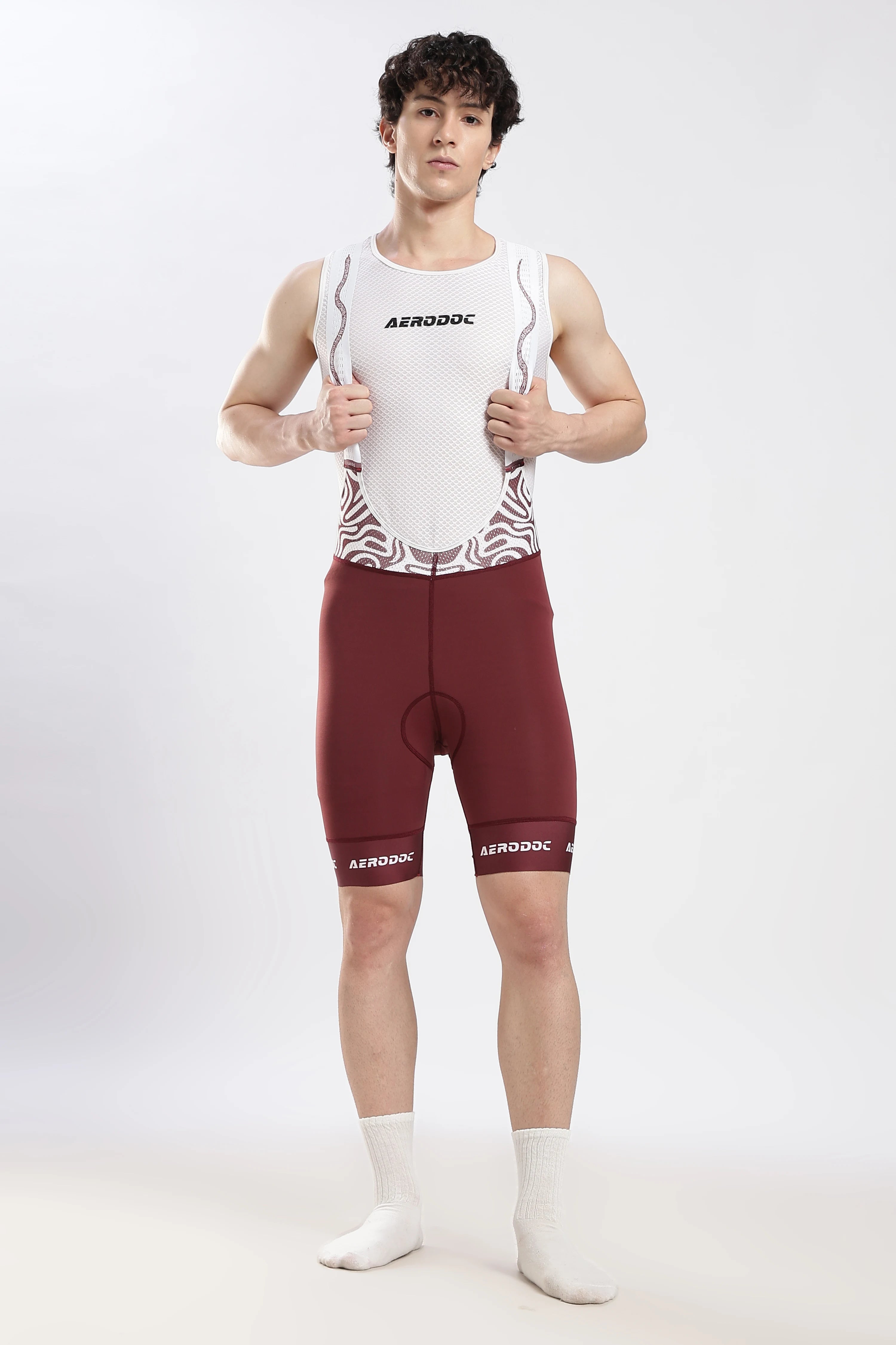 Model wearing Nitro Crimson Wine gel padded cycling bib shorts front view