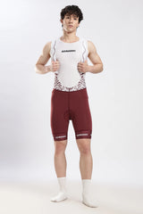Model wearing Nitro Crimson Wine gel padded cycling bib shorts front view