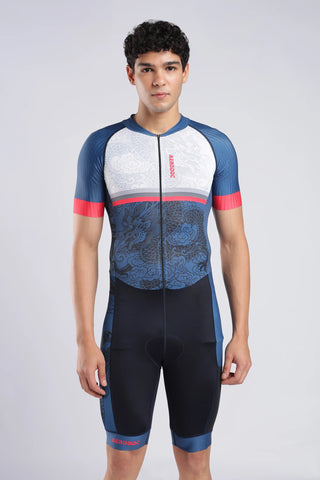 A male model wearing a AERODOC trisuit use for swimming running and cycling. The trisuit features a white upper chest, blue sleeves, a blue dragon graphic across the torso, and red accents on the collar, underbust