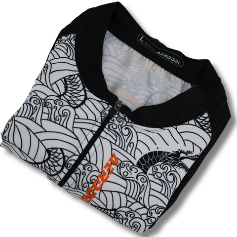 Black and orange cycling suit with a pattern on a white background
